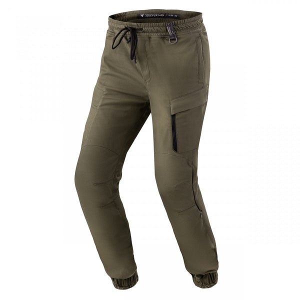 Shima Kevlar Mc-Byxor Joggster Khaki med elastisk midja, dragkedjeförsedda fickor och förstärkt material för motorcykelanvändning.